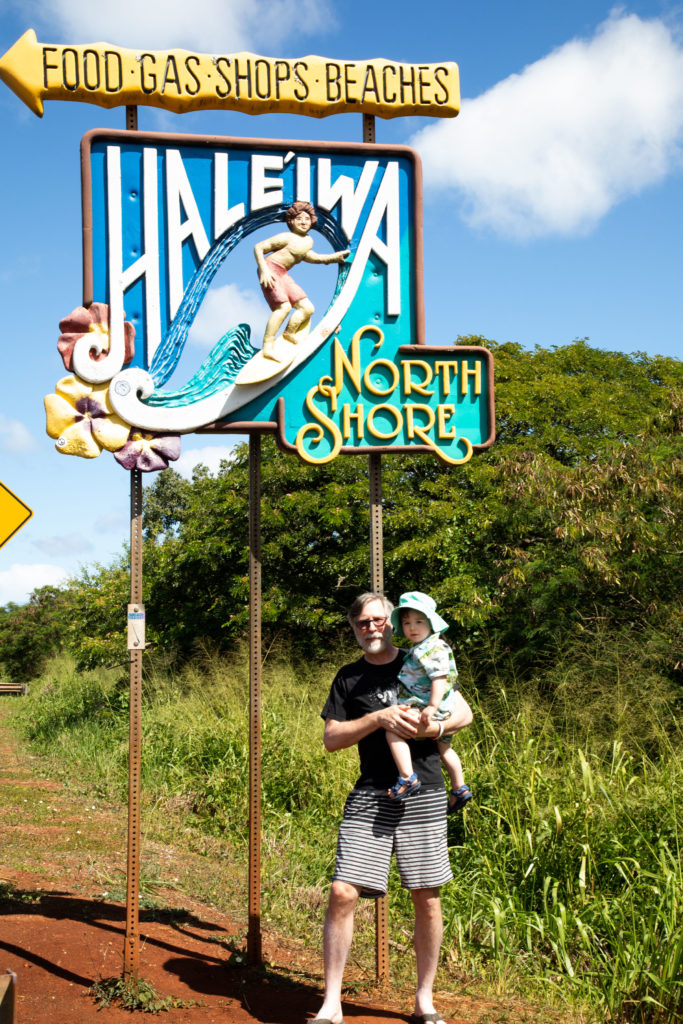 Obligatory cheesy photos should be part of every trip with your grandchildren, like posing in front of the Haleiwa surf sign.